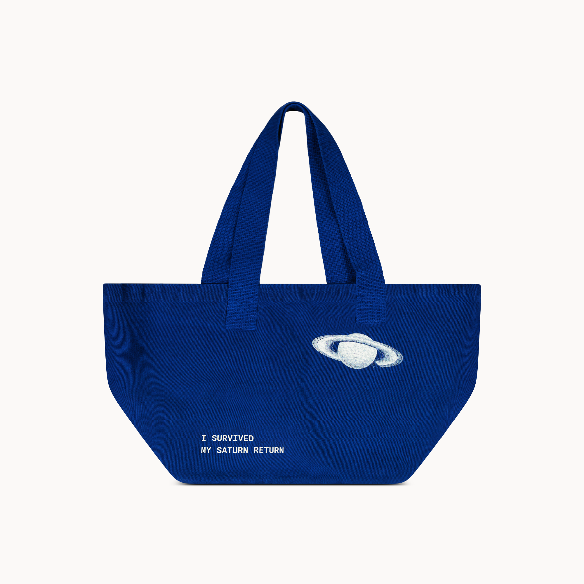 Blue, Durable 13oz bull denim tote bag with 'I Survived My Saturn Return' text, ideal astrology gift for those completing their Saturn return